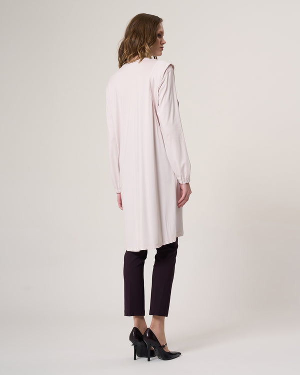 Back view of the 35025 beige longline tunic with long sleeves and a softly draped silhouette
